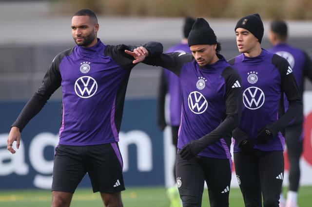 Jonathan Tah (left) with Bayern duo Leroy Sané and Jamal Musiala.