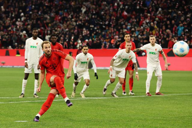 Harry Kane scores the first of his three goals from the spot.