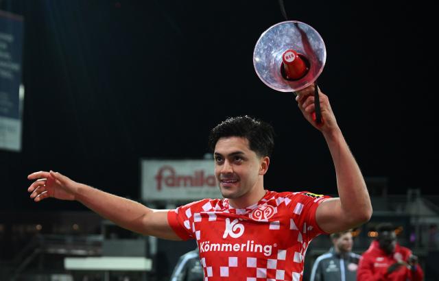 Nadiem Amiri celebrates with Mainz away supporters on Sunday. 