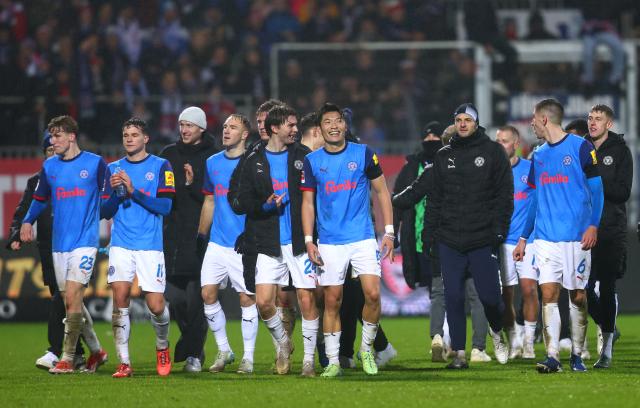 Holstein Kiel players celebrate their massive home win on Saturday. 