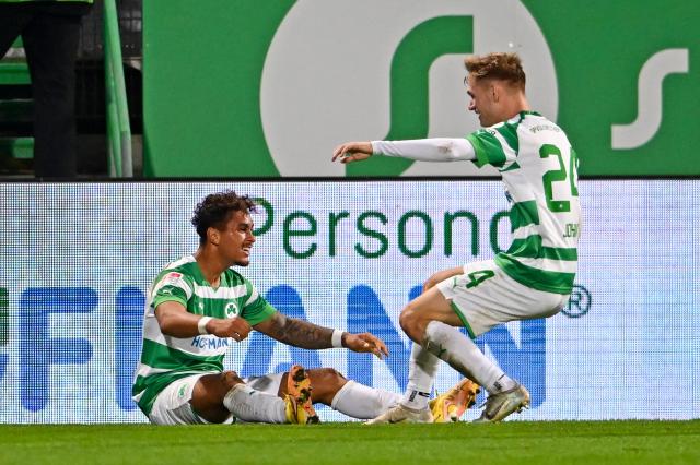 Marco John celebrates  a goal with Armindo Sieb whilst playing at Fürth in October of 2022.